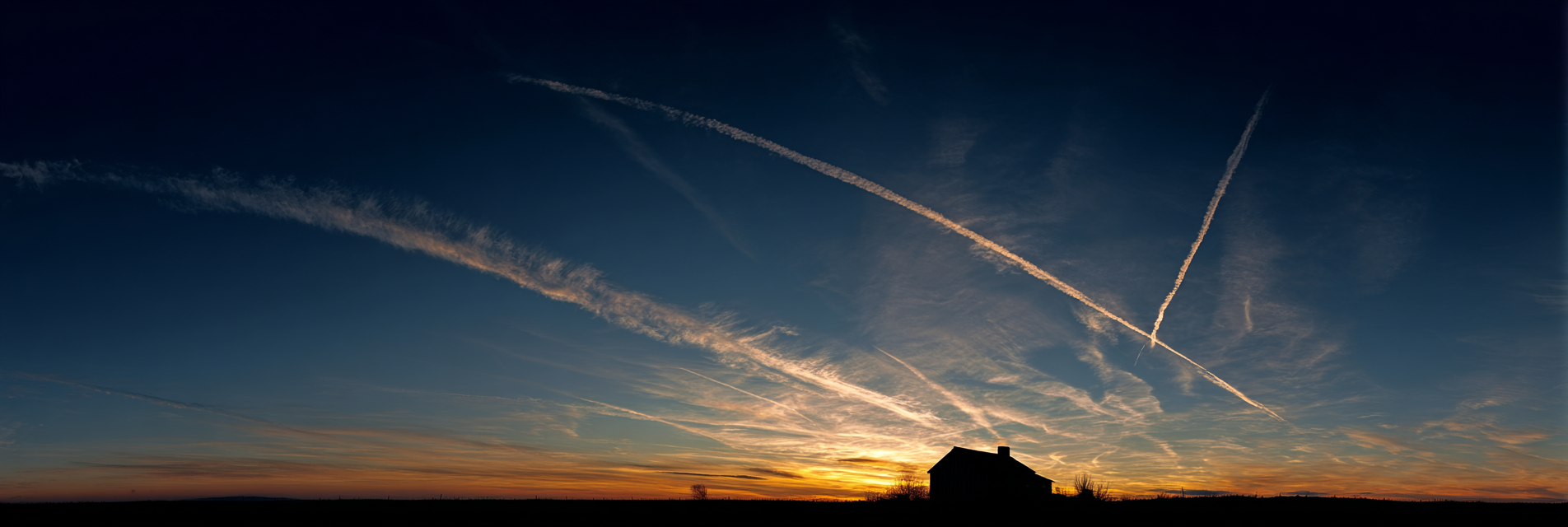 Farmhouse porch at twilight with telescope and rocking chair, looking out toward the horizon